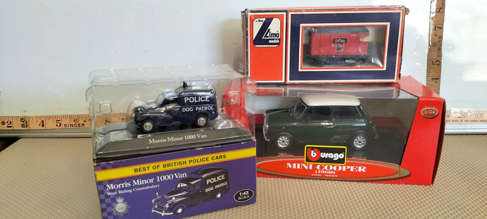 Lot 169 – Three Boxed Model Vehicles comprising Bburago Mini Cooper, Morris Minor Police Van, and Lima Railway Wagon