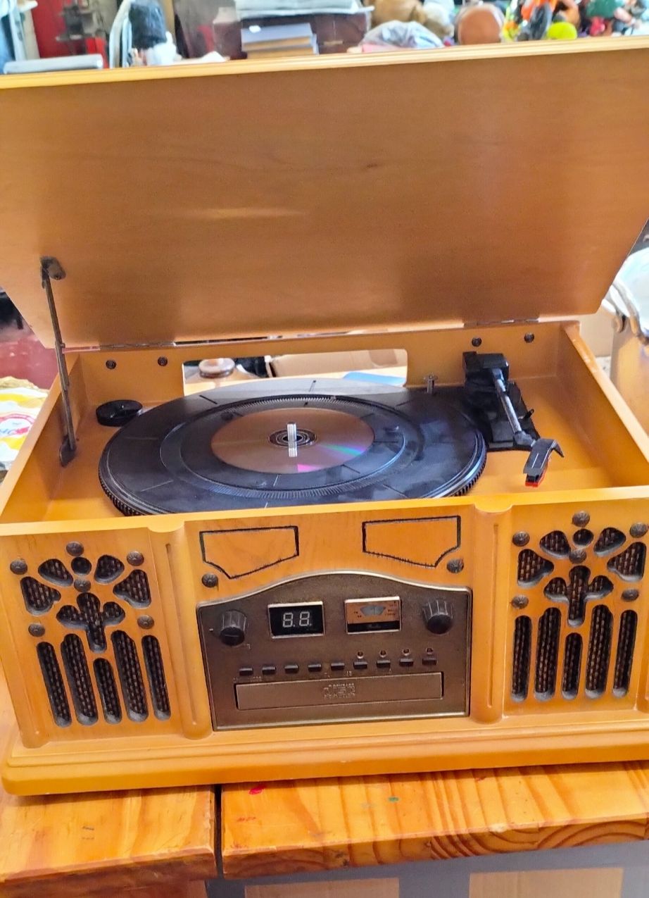 Lot 173 – A vintage-style wooden music centre featuring record player, CD player and AM/FM radio