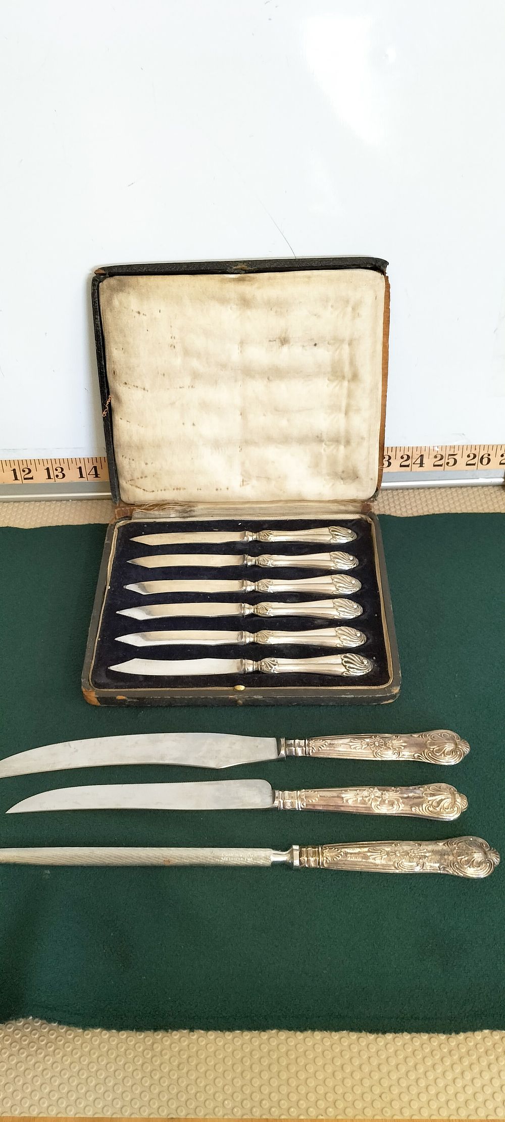 Lot 197 – A three-piece silver-handled carving set by Harrison Brothers & Howson and a cased set of six knives