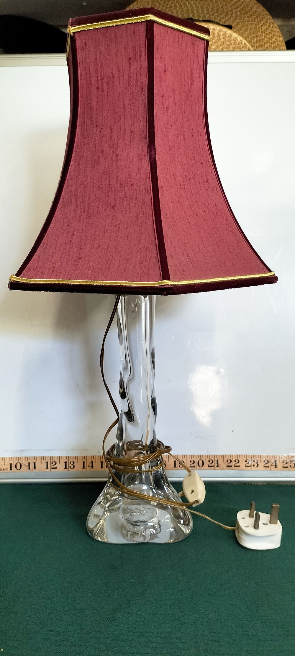 Lot 208 – A mid-century clear sculptural glass table lamp with maroon fabric shade