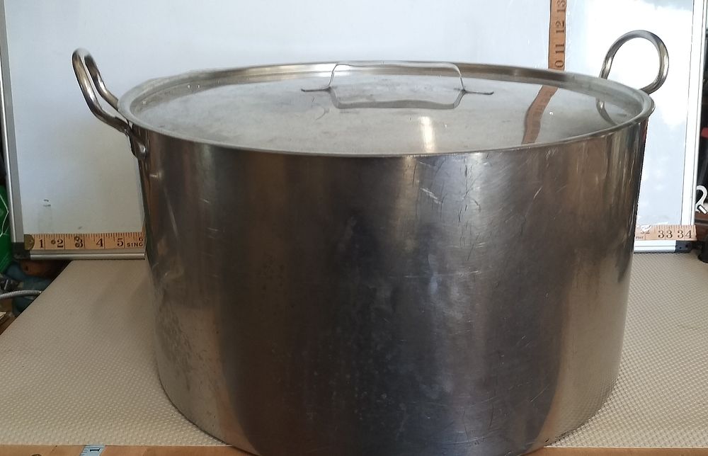Lot 215 – A Large Industrial Stainless Steel Stock Pot with Matching Lid