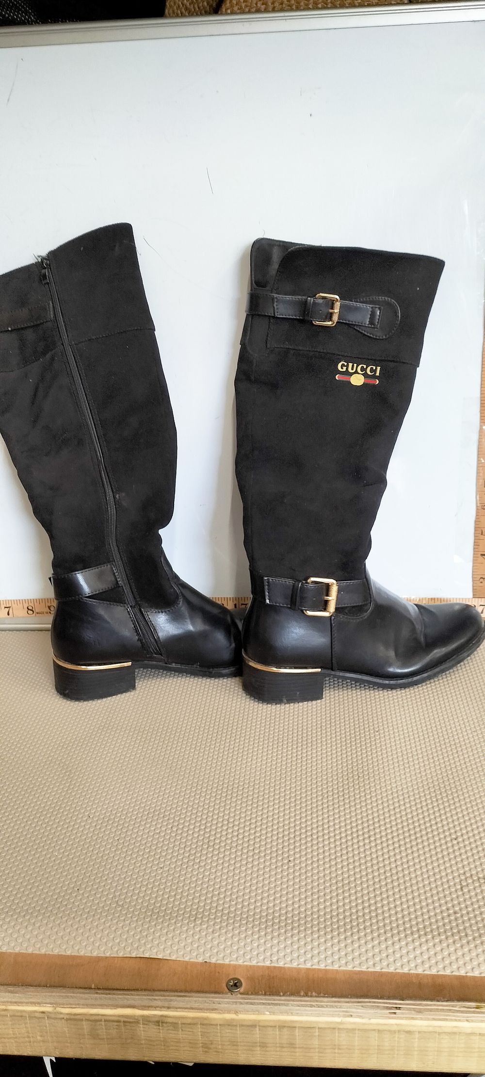 Lot 218 – A Pair of Women’s Black Knee-High Riding Style Boots Bearing Gucci Marks