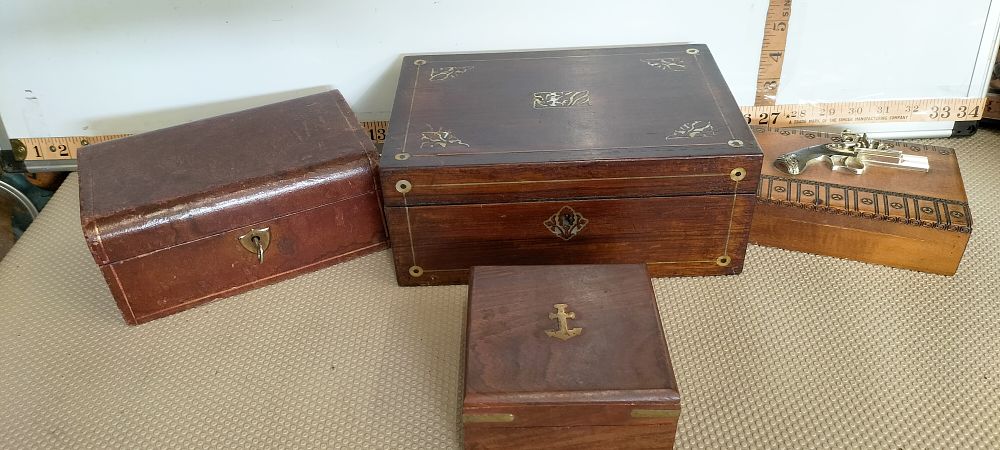Lot 183 – A Collection of four antique and vintage wooden and leather-bound boxes including a Joseph Egg presentation case