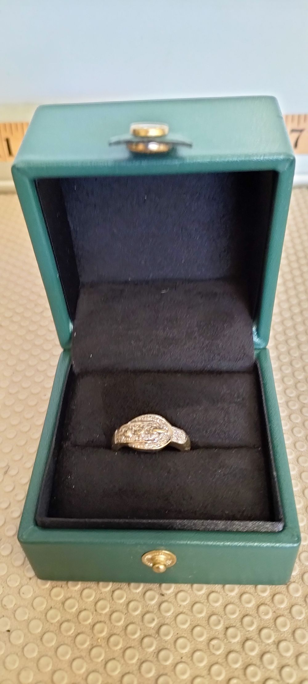 Lot 194 – Gold and Clear Stone Buckle Ring