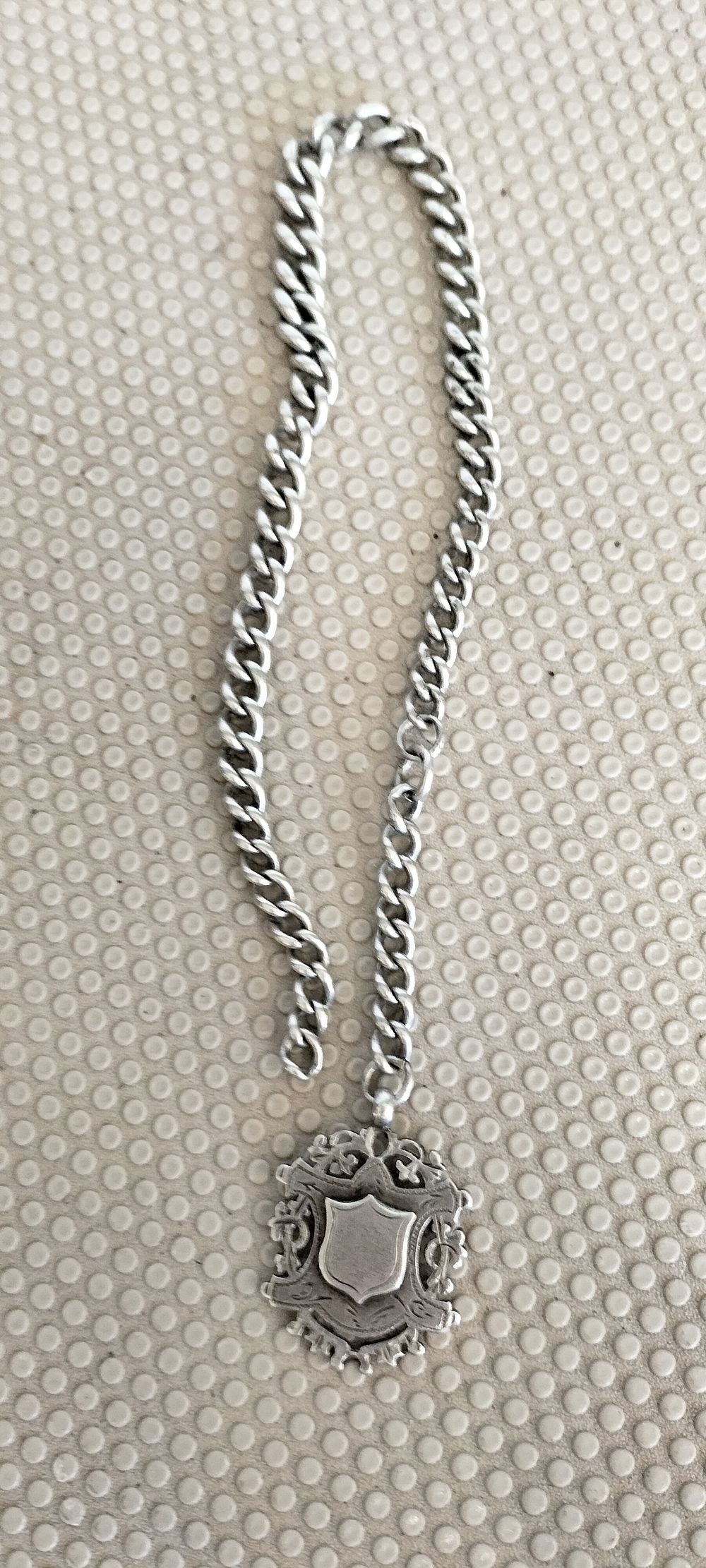 Lot 196 – Edwardian Sterling Silver Watch Fob Chain and Pendant by William Hair Haseler