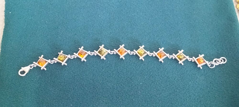Lot 158 – Polish Sterling Silver and Multi-Tone Baltic Amber Geometric Link Bracelet