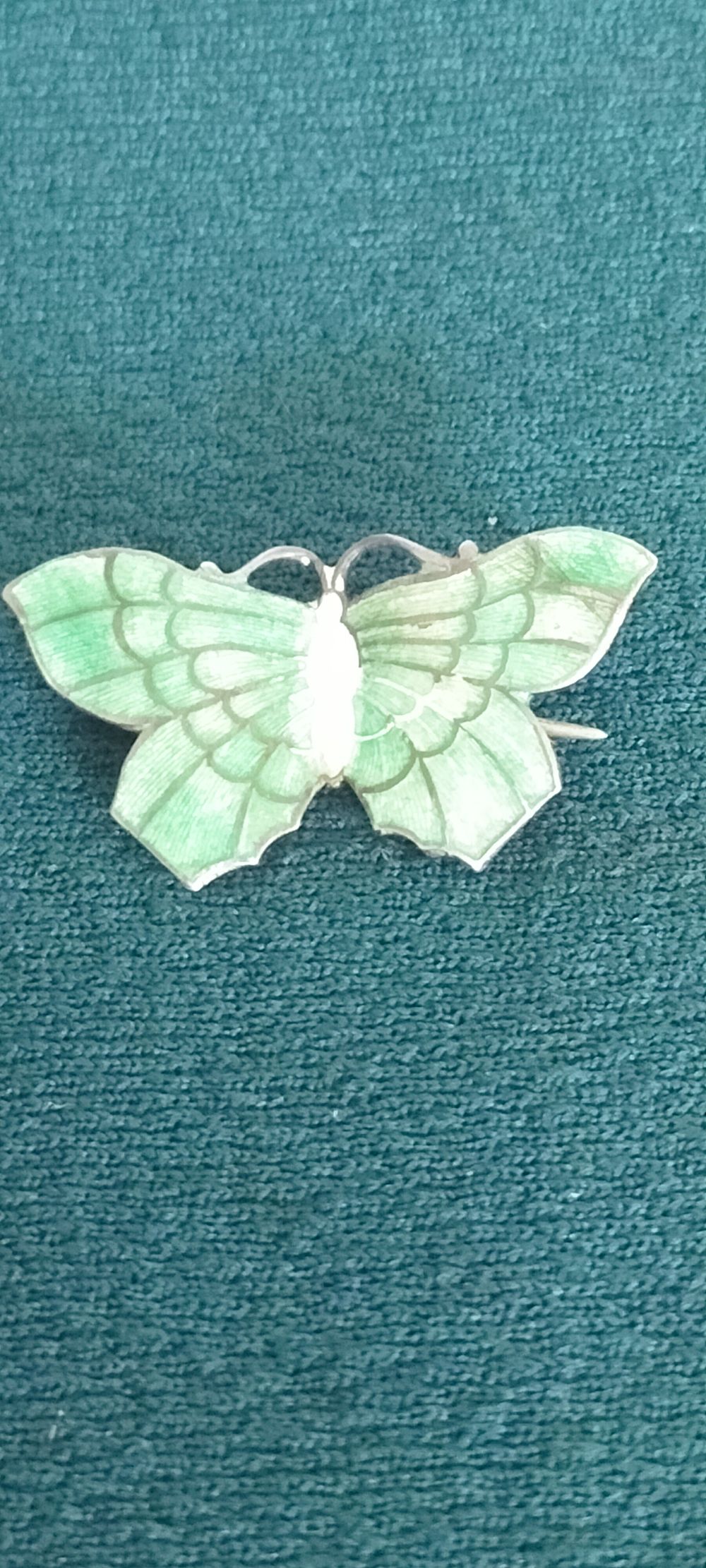 Lot 160 – A mid-20th century sterling silver and green guilloché enamel butterfly brooch