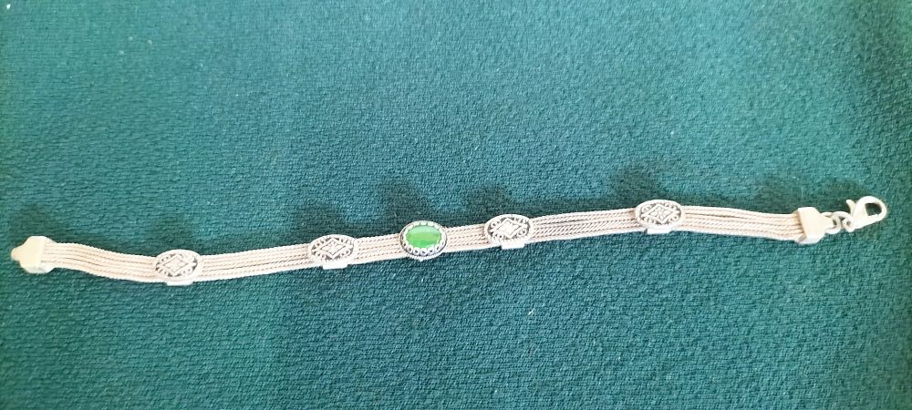 Lot 162 – Silver Multi-Strand Woven Link Bracelet with Green Chatoyant Stone
