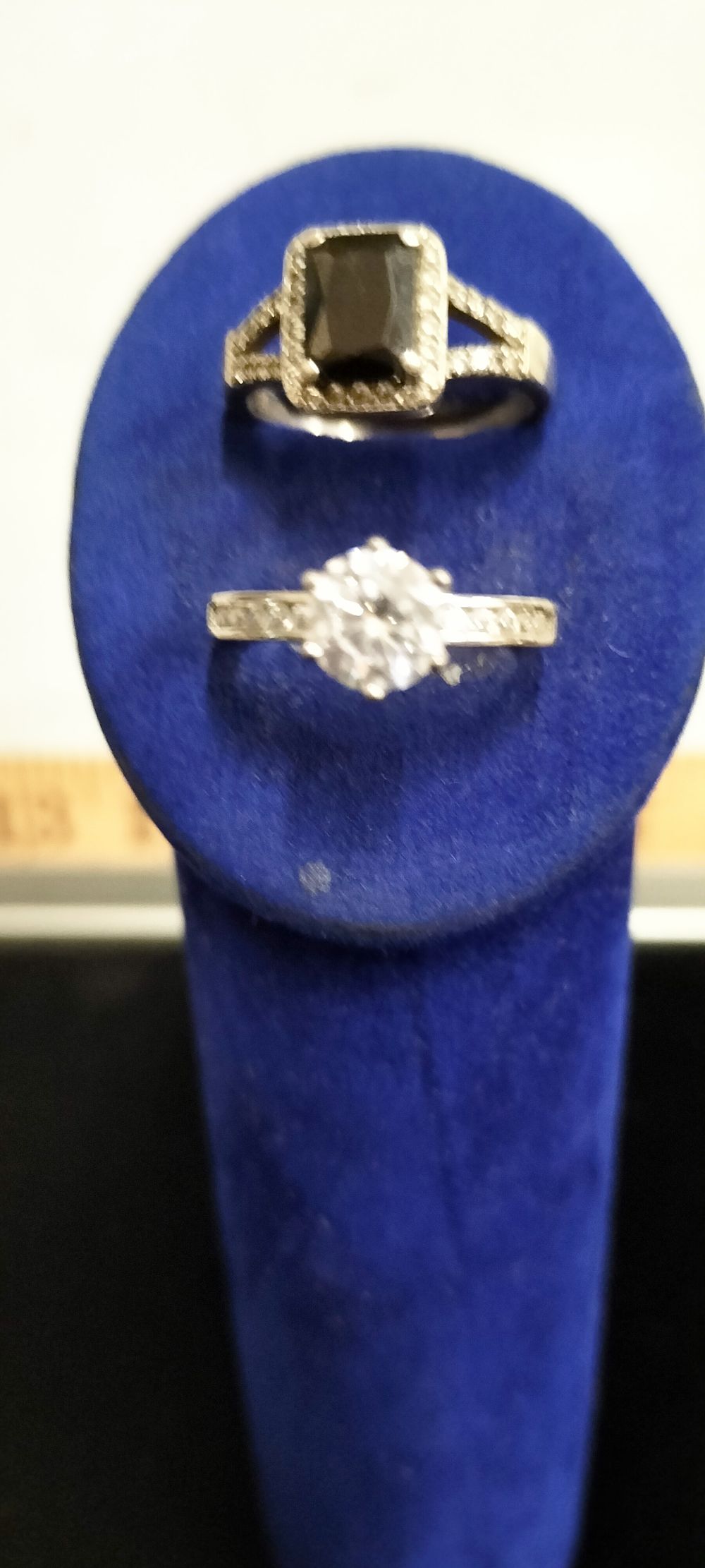 Lot 168 – Two Silver dress rings including a black stone halo ring and a clear stone solitaire ring