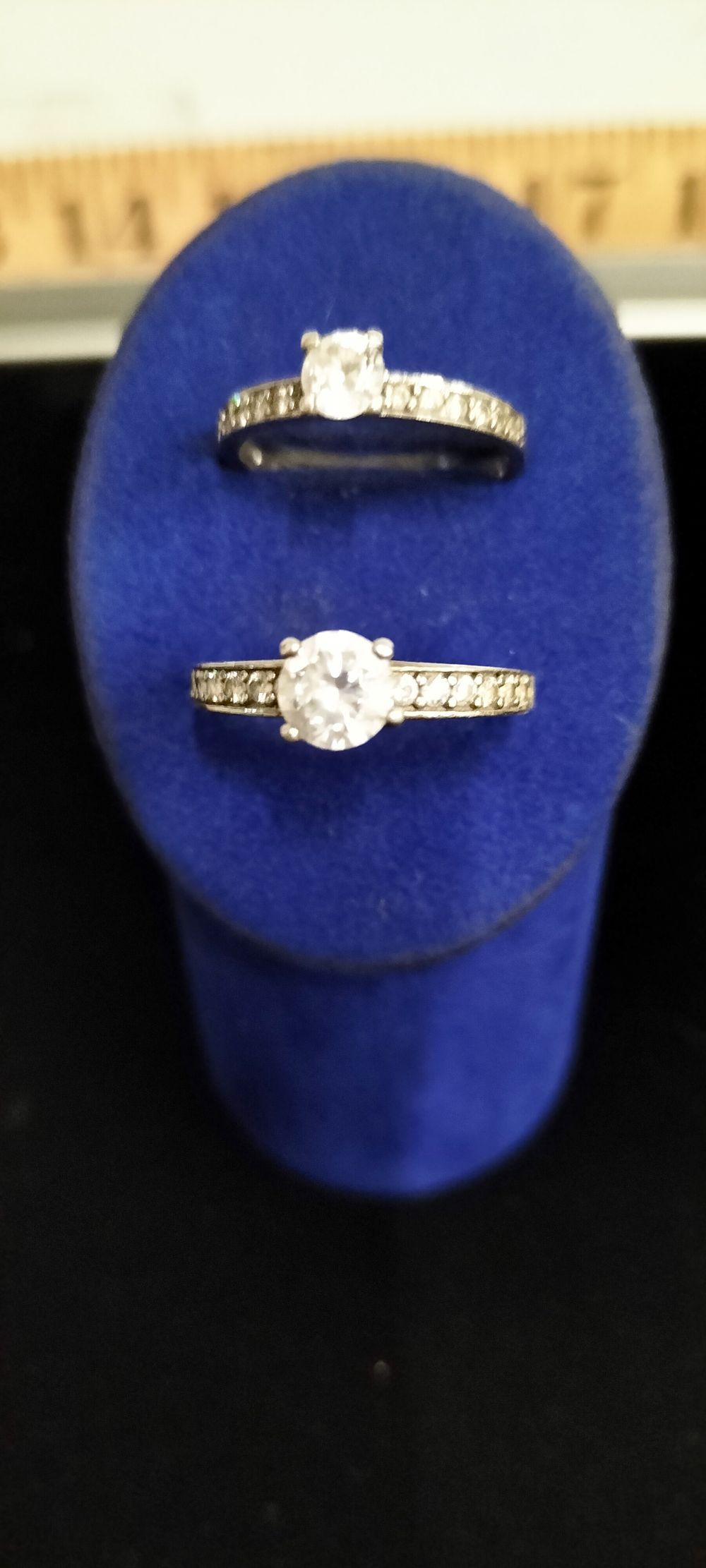 Lot 173 – A Pair of Silver Solitaire and Channel Set Rings