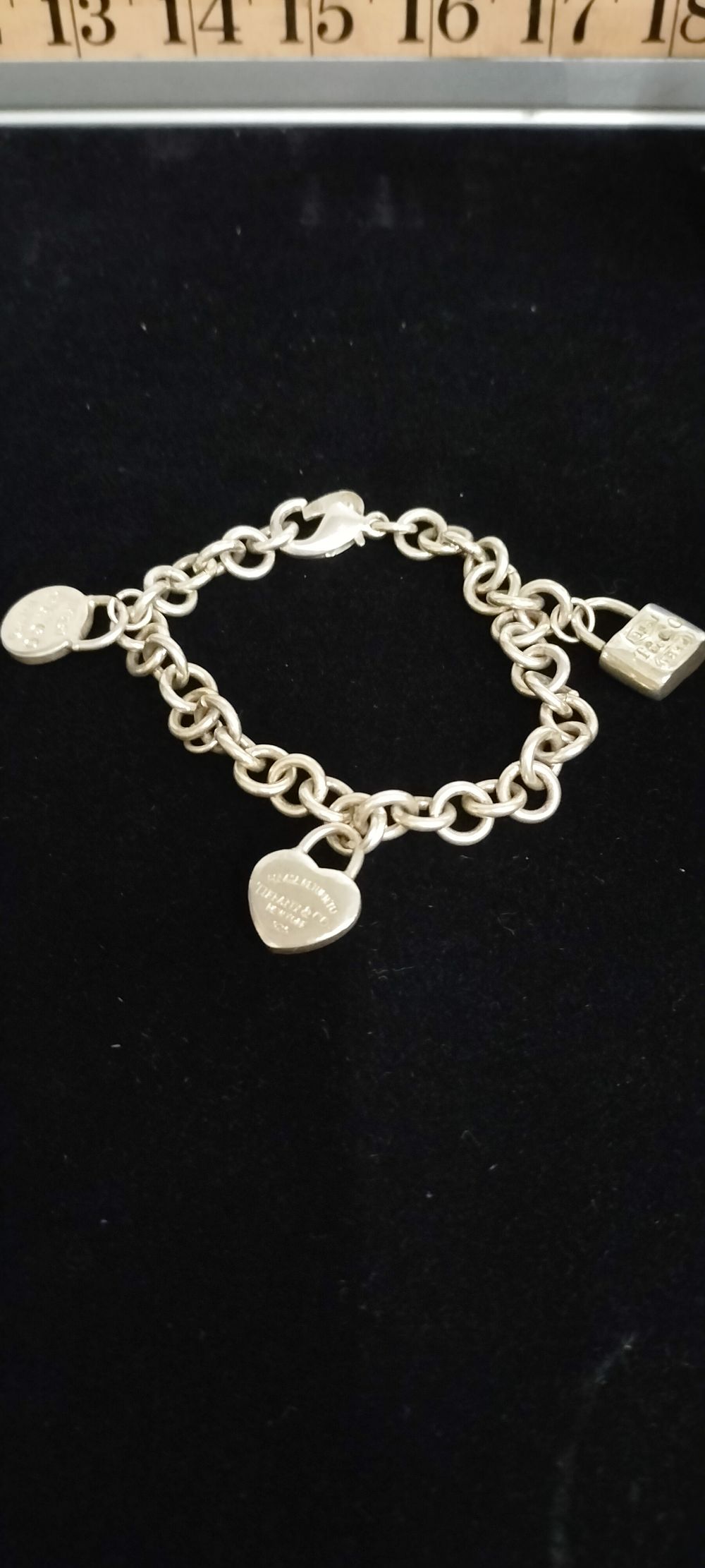 Lot 174 – Tiffany and Co Sterling Silver Return to Tiffany and 1837 Multi Charm Bracelet