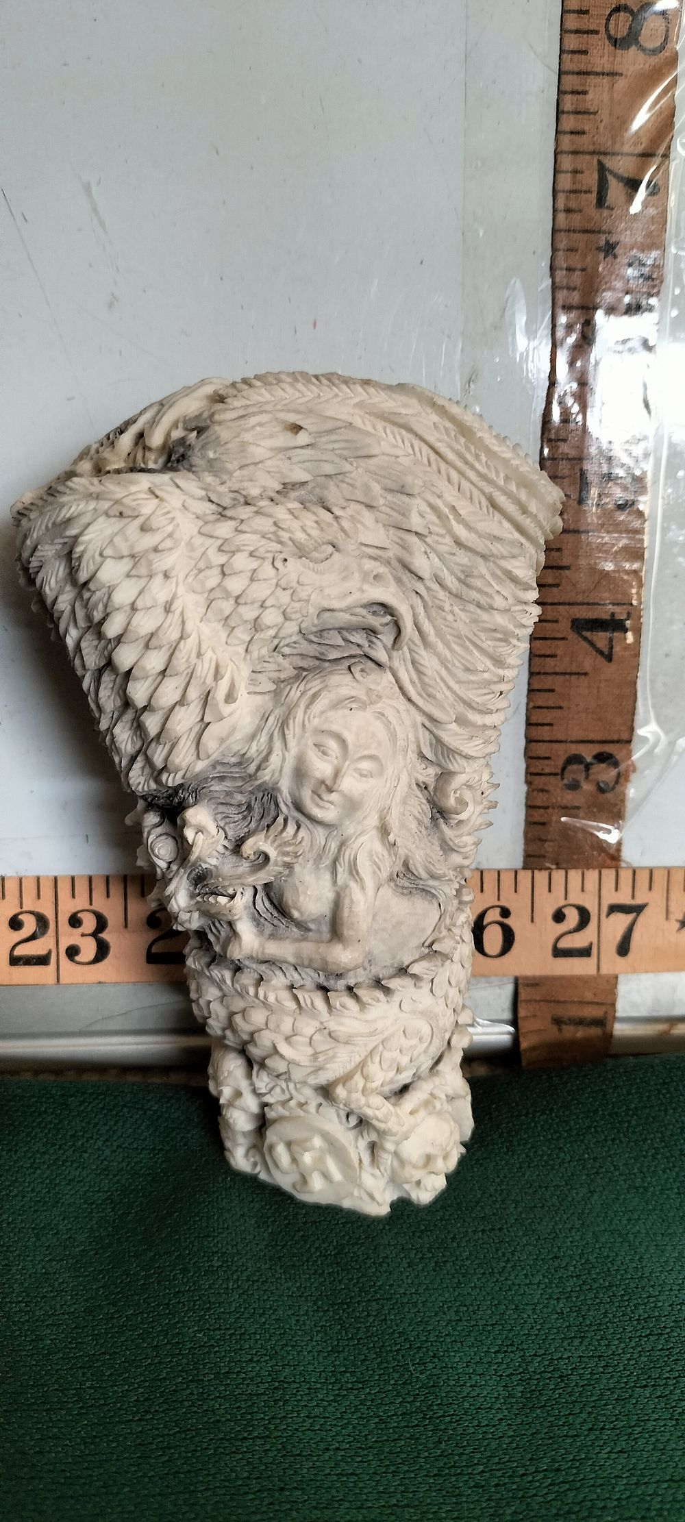 Lot 155 – A Carved Bone Eagle Angel Skull and Dragon Sculpture