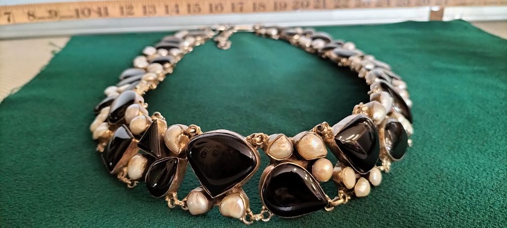 Lot 164 – A Silver Black Onyx and Baroque Pearl Collar Necklace