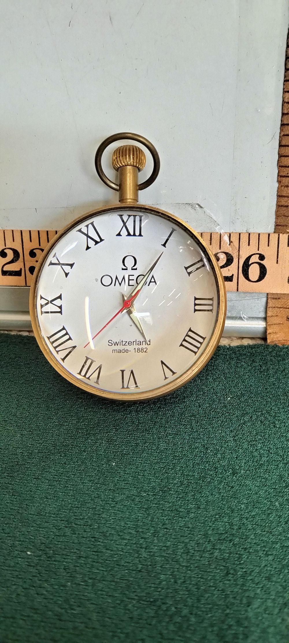Lot 189 – A Brass Omega Style Spherical Desk Watch
