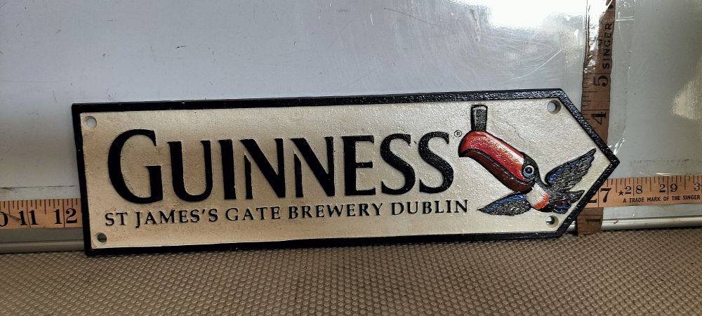 Lot 212 – A Cast Iron Guinness Toucan Motif Advertising Sign