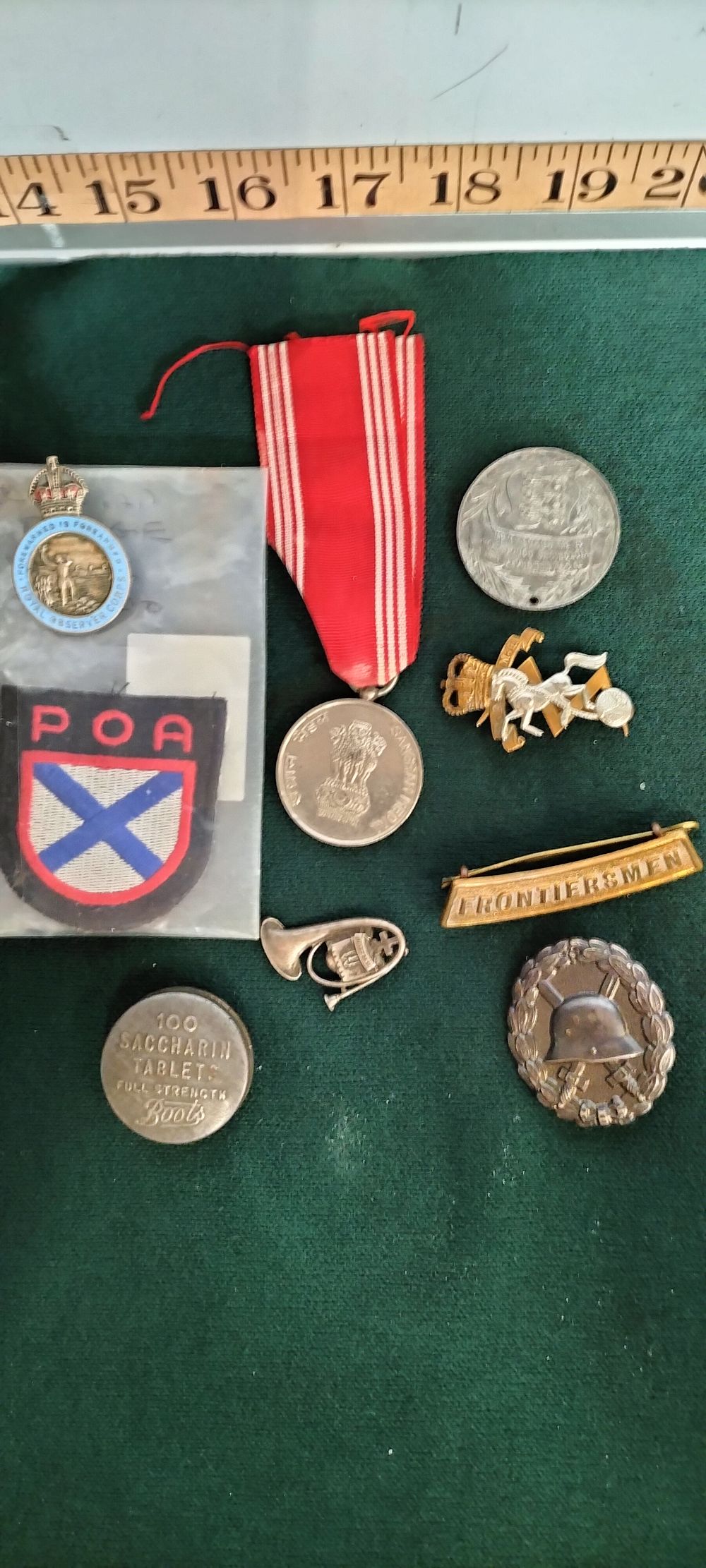 Lot 224 – A Collection of Brass and Silver Military Insignia and Medals
