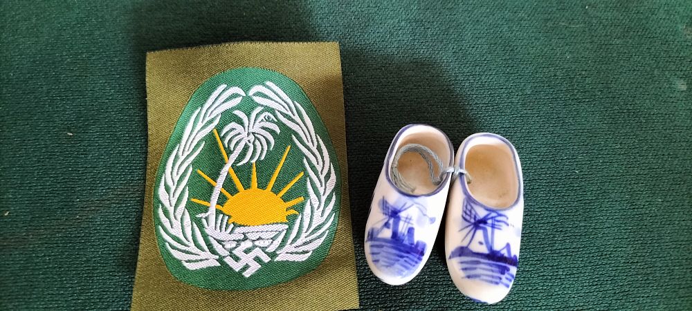 Lot 229 – A Cloth Palm Tree Motif Patch and Ceramic Clogs