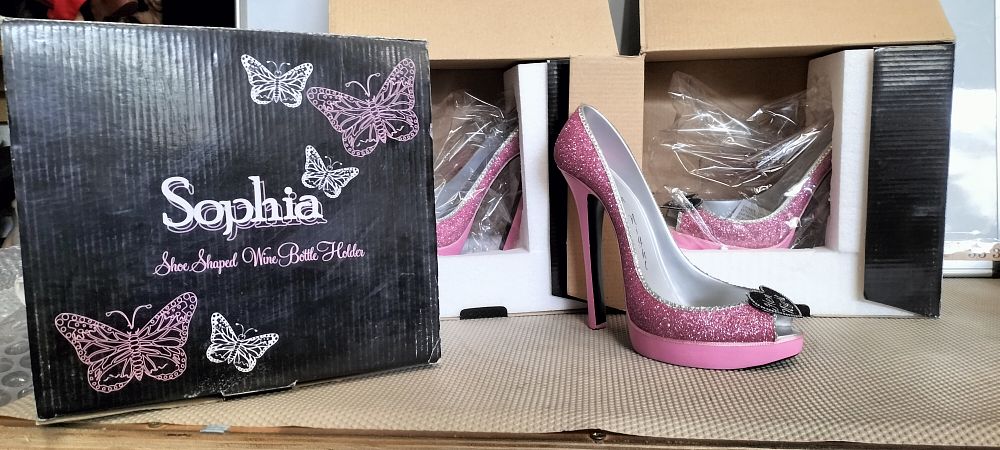 Lot 248 – A Trio of Resin Sophia Shoe Wine Bottle Holders
