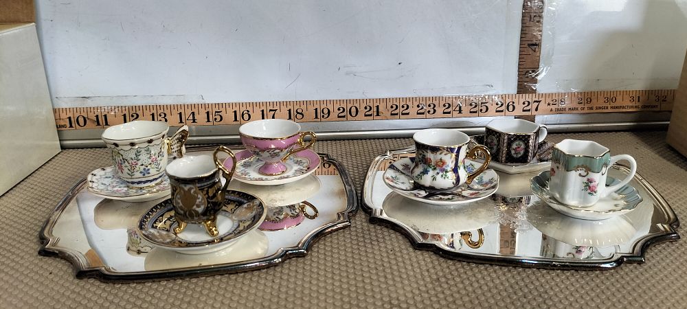 Lot 252 – A Porcelain Miniature Cabinet Cup Collection and two Mirrored Silver Trays