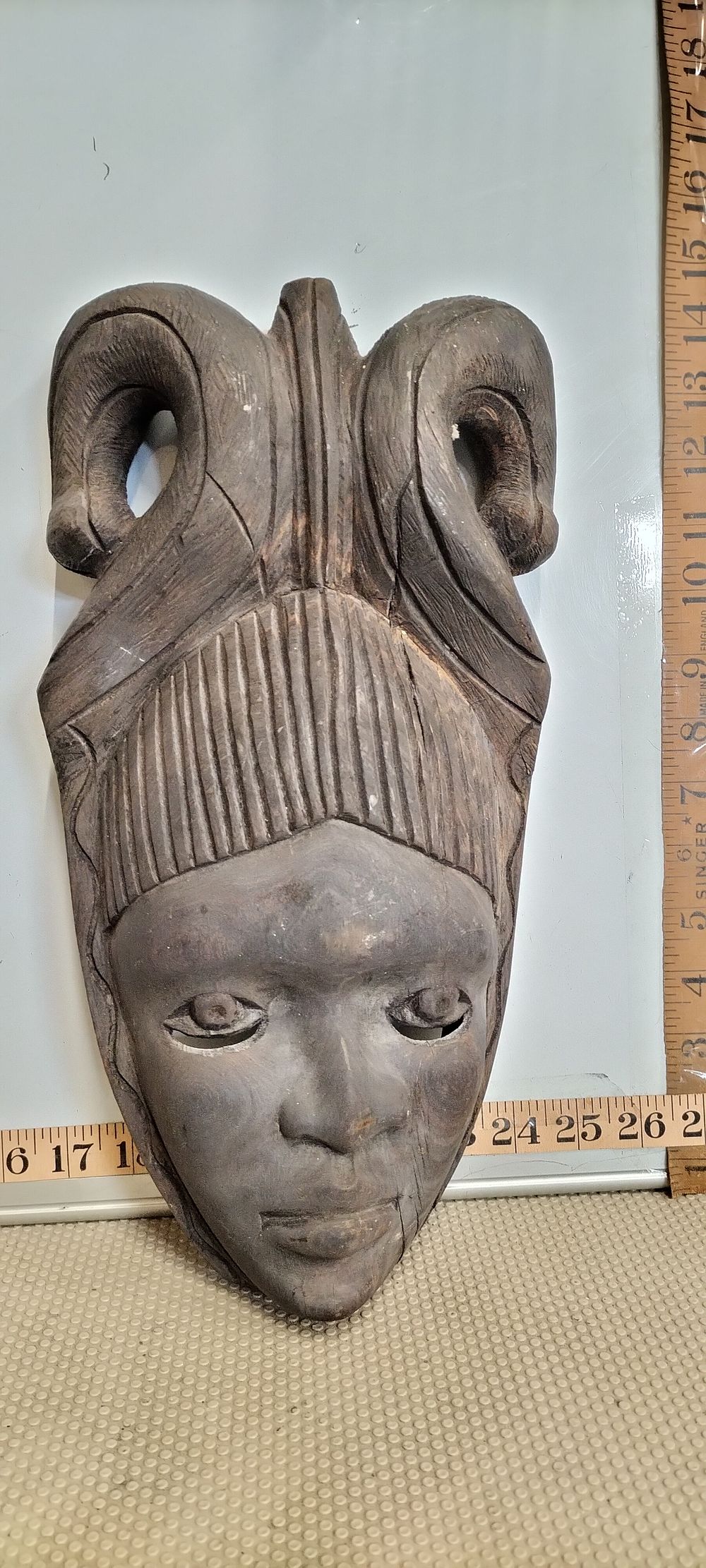 Lot 262 – A Wood Carved West African Horned Mask