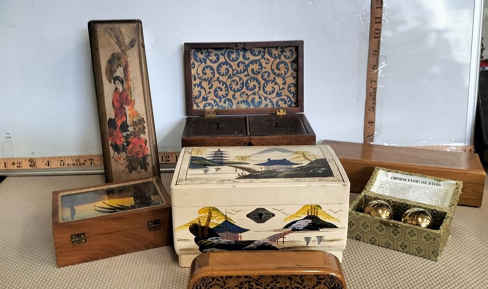 Lot 265 – An Assortment of Lacquer and Wood Decorative Boxes and Exercise Balls