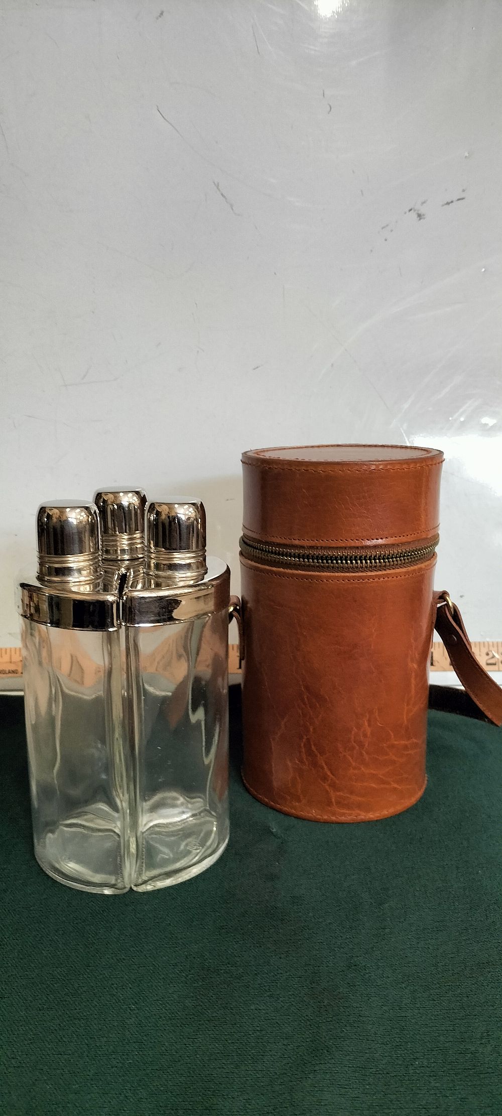 Lot 167 – A Leather and Glass Art Deco Triple Flask Set