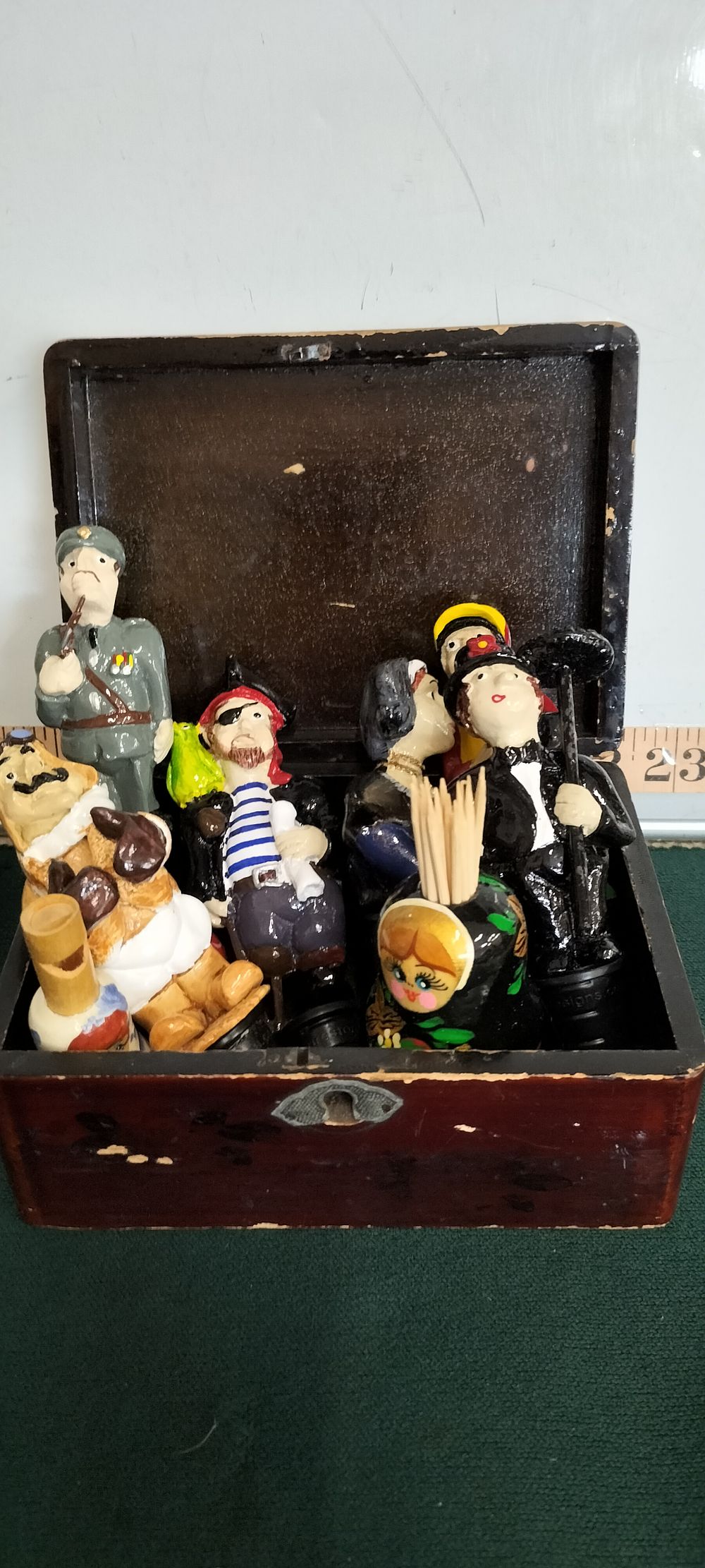 Lot 174 – A Collection of Resin Character Bottle Stoppers and Wooden Russian Folk Art