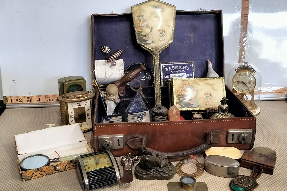 Lot 160 – A Leather Suitcase Containing An Assortment Of Clocks And Collectables
