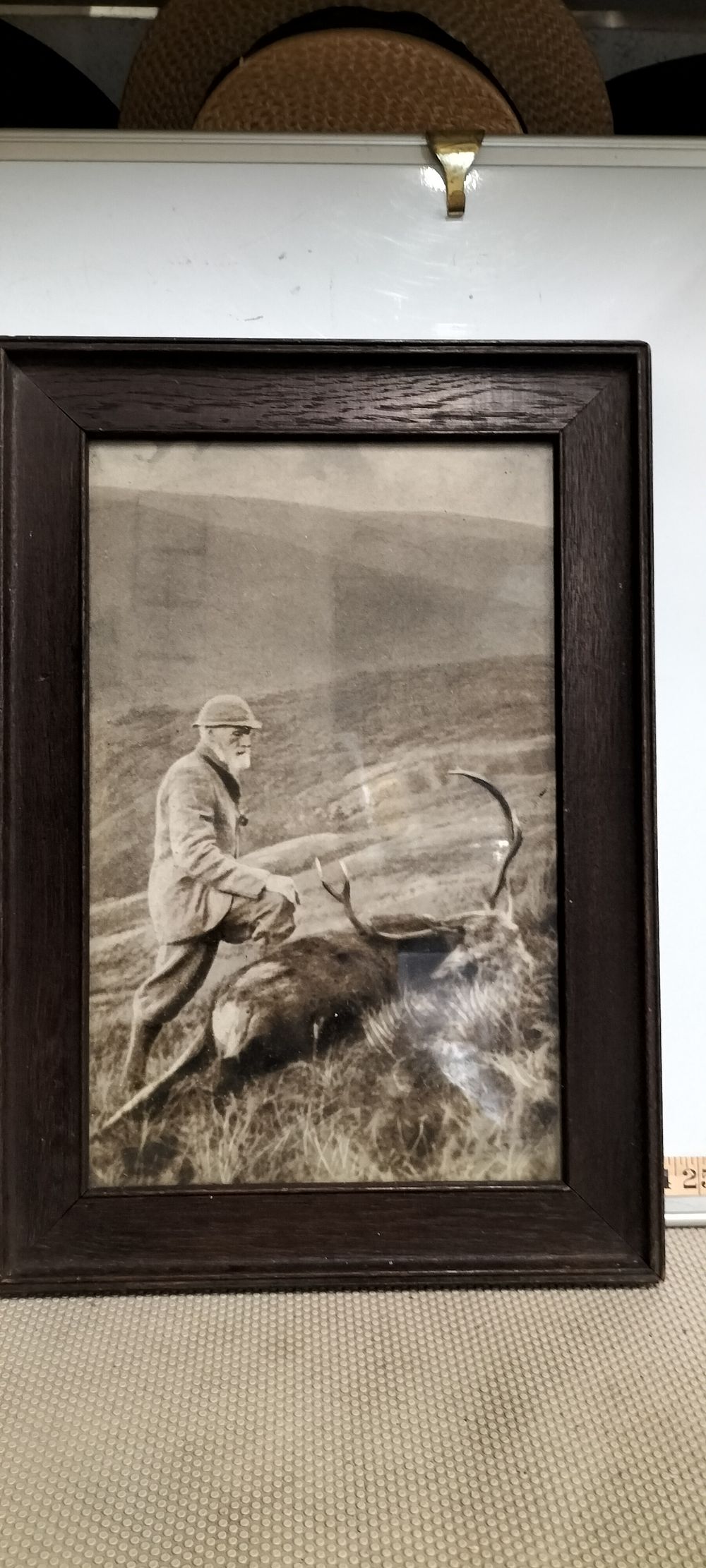 Lot 169 – Oak Framed Monochrome Photograph Of A Stalker With Red Deer Stag