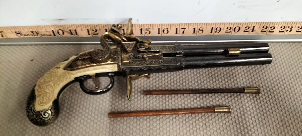 Lot 185 – A Brass and Resin Over-Under Flintlock Style Pistol