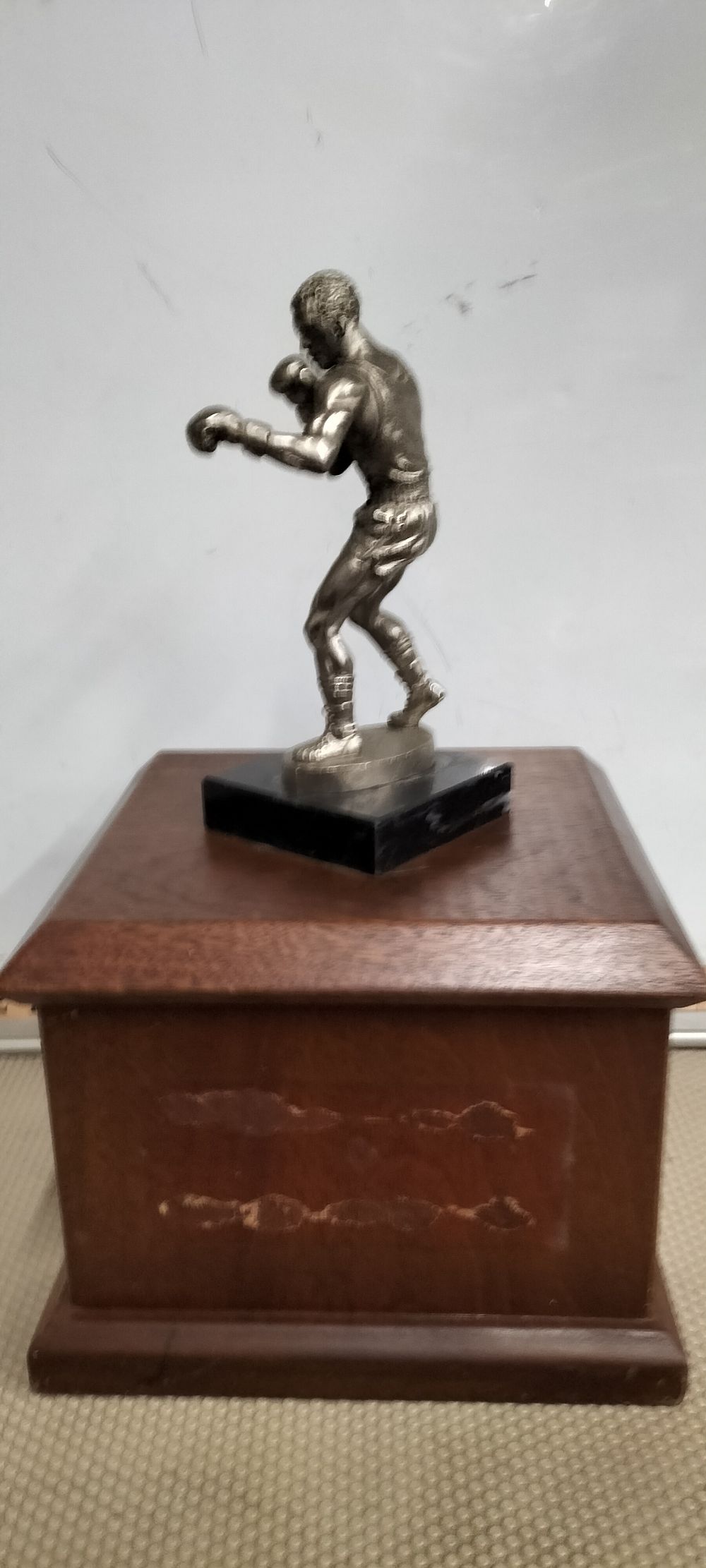 Lot 189 – A Silver coloured Boxing Trophy On A Wooden Presentation Base