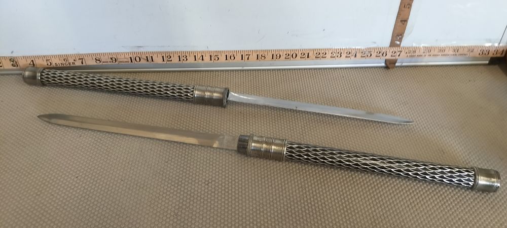 Lot 10 – A Nickel Plated Steel Interlocking Double Bladed Sword Staff