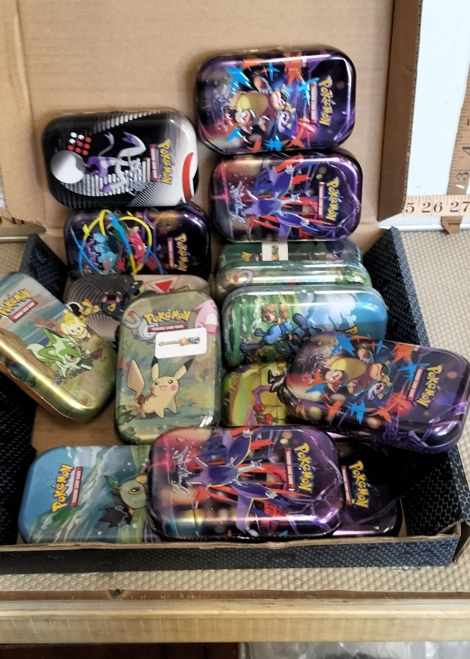 Lot 13 – A Collection of Pokémon Trading Card Game Metal Mini Tins