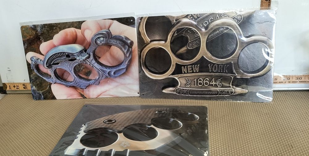 Lot 15 – Metal Knuckle Duster Photographic Print Decorative Signs