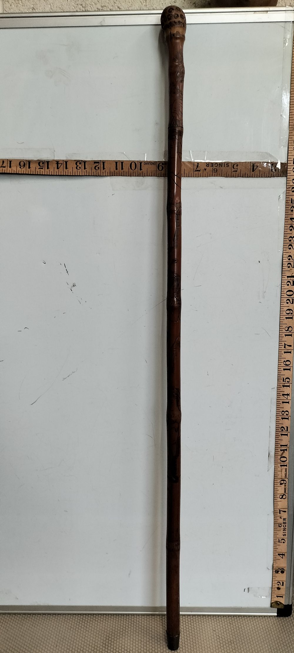 Lot 21 – A Japanese Carved Bamboo Sword Stick System Cane