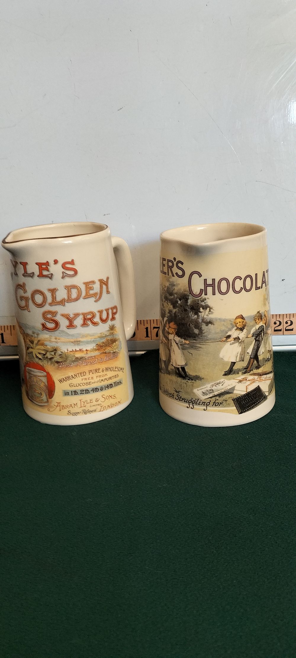 Lot 30 – A Pair of Earthenware Lyle’s Golden Syrup and Kohler’s Chocolate Advertising Pitchers