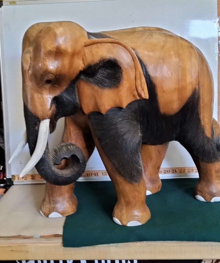 Lot 34 – A Large Two Tone Hand Carved Wood Elephant Sculpture