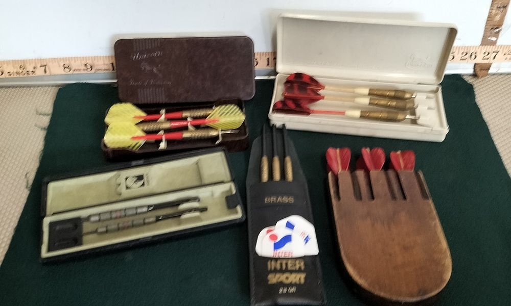 Lot 63 – A Collection of Brass and Steel Darts and Accessories