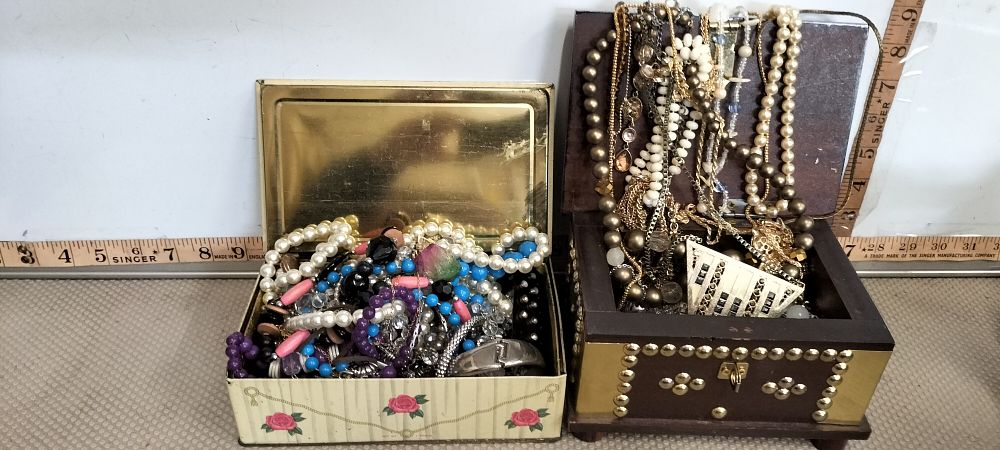 Lot 75 – An Assortment of Costume Jewellery in a Rectangular Tin and Studded Wooden Casket