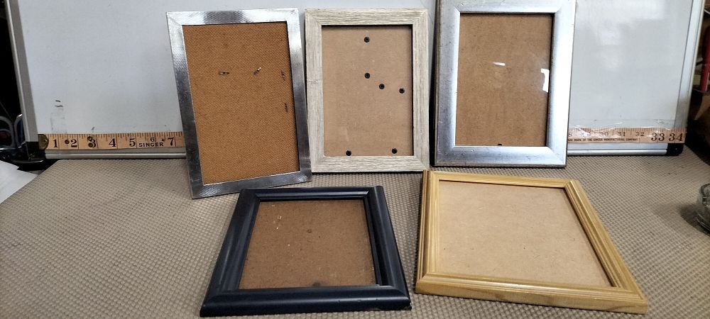 Lot 99 – Silver Engine Turned Portrait Frame and Four Assorted Frames