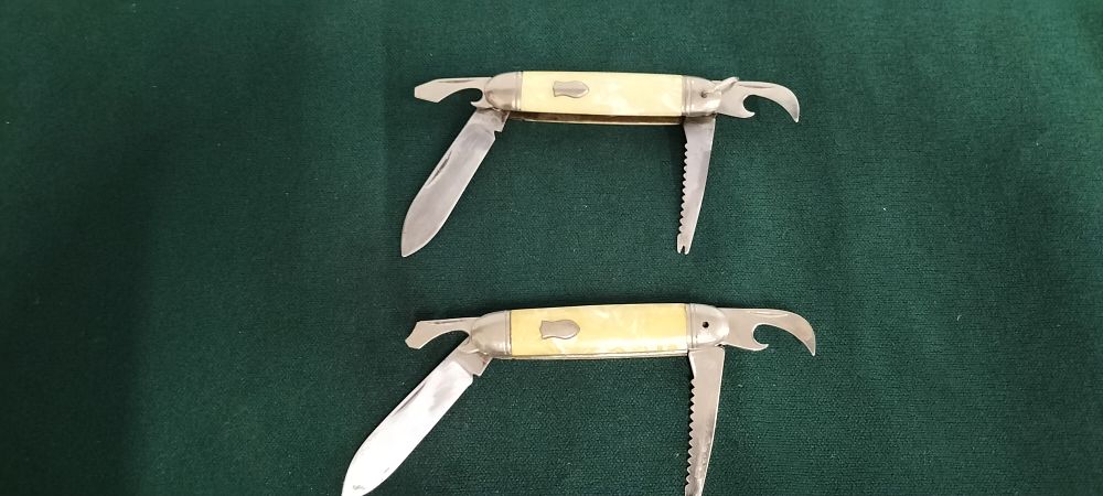Lot 117 – A Pair of Steel and Celluloid Angler Pocket Knives