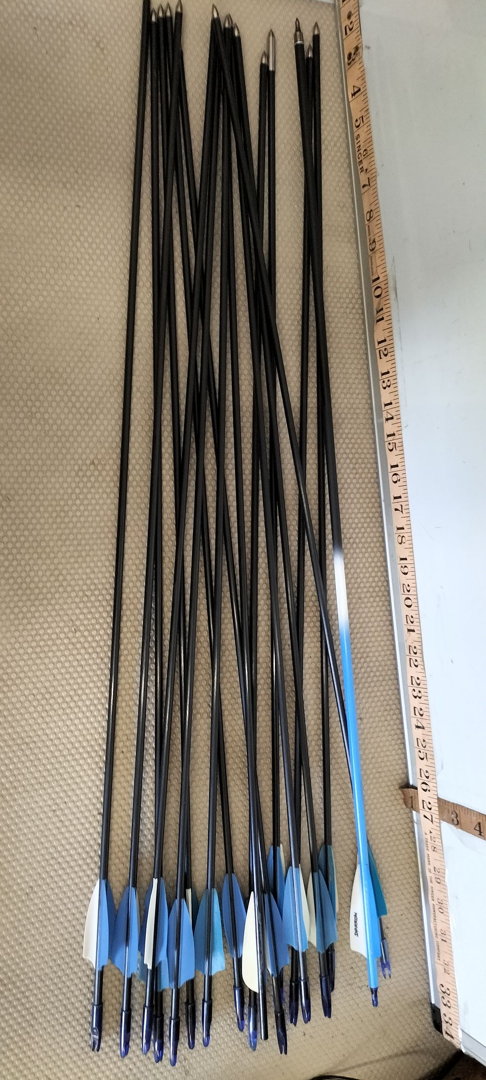 Lot 125 – A Collection of Carbon Composite Archery Arrows and a Swarrow Arrow