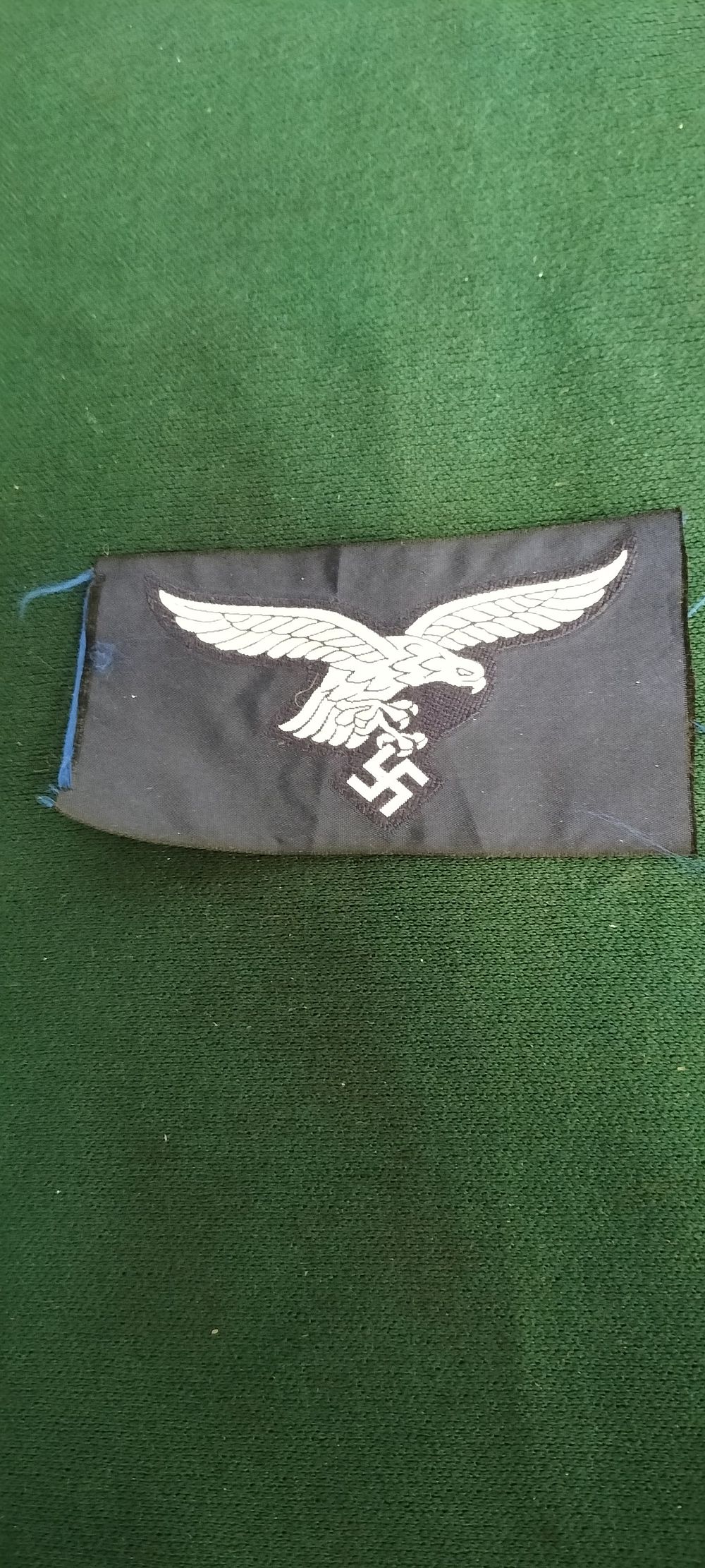 Lot 142 – A Cloth WWII German Luftwaffe Enlisted Man Breast Eagle