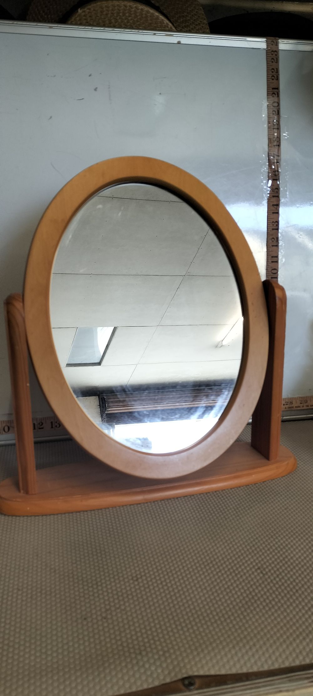 Lot 149 – A Light Wood Oval Freestanding Swing Mirror