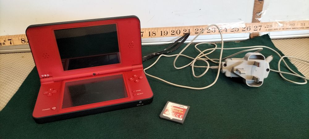 Lot 158 – A Nintendo DSi XL Console With Professor Layton Game