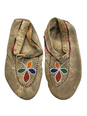 Native American Beaded Moccasins. Pair of American Indian moccasins decorated with beads in a 