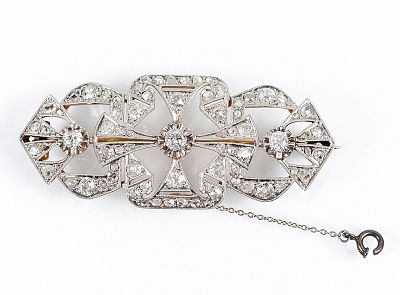 Bello alfiler vintage, "art-decó", en montura de oro amarillo 18 K, con tres centros con 