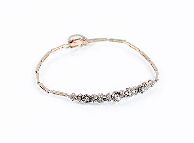 Pulserita antigua en delicada montura de oro rosa 18 K con vistas grafiladas de platino y tres 