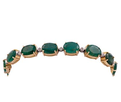 PULSERA EN ORO BICOLOR 14KT, ESMERALDAS Y DIAMANTES. Pulsera realizada en oro bicolor de 14kt 