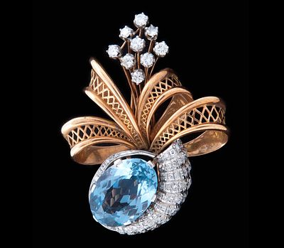 BROCHE EN ORO 18KT, DIAMANTES Y TOPACIO. Broche realizado en oro de 18kt con vistas en platino 